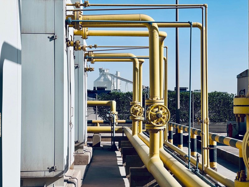 Industrial Equipment Sourcing Company — Valves, Pipe, OCTG, MRO Supplies Yellow industrial gas pipes at a process plant — pipe and tubulars supplier worldwide