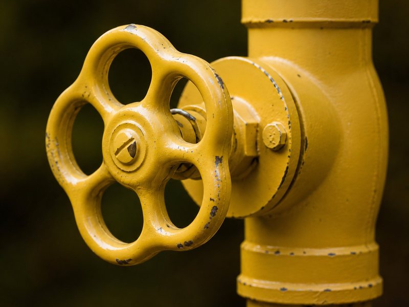 Industrial Equipment Sourcing Company — Valves, Pipe, OCTG, MRO Supplies Large yellow handwheel gate valve on a pipeline — industrial valves supplier