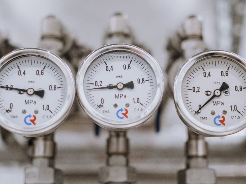 Industrial Equipment Sourcing Company — Valves, Pipe, OCTG, MRO Supplies Row of analog pressure gauges on process piping